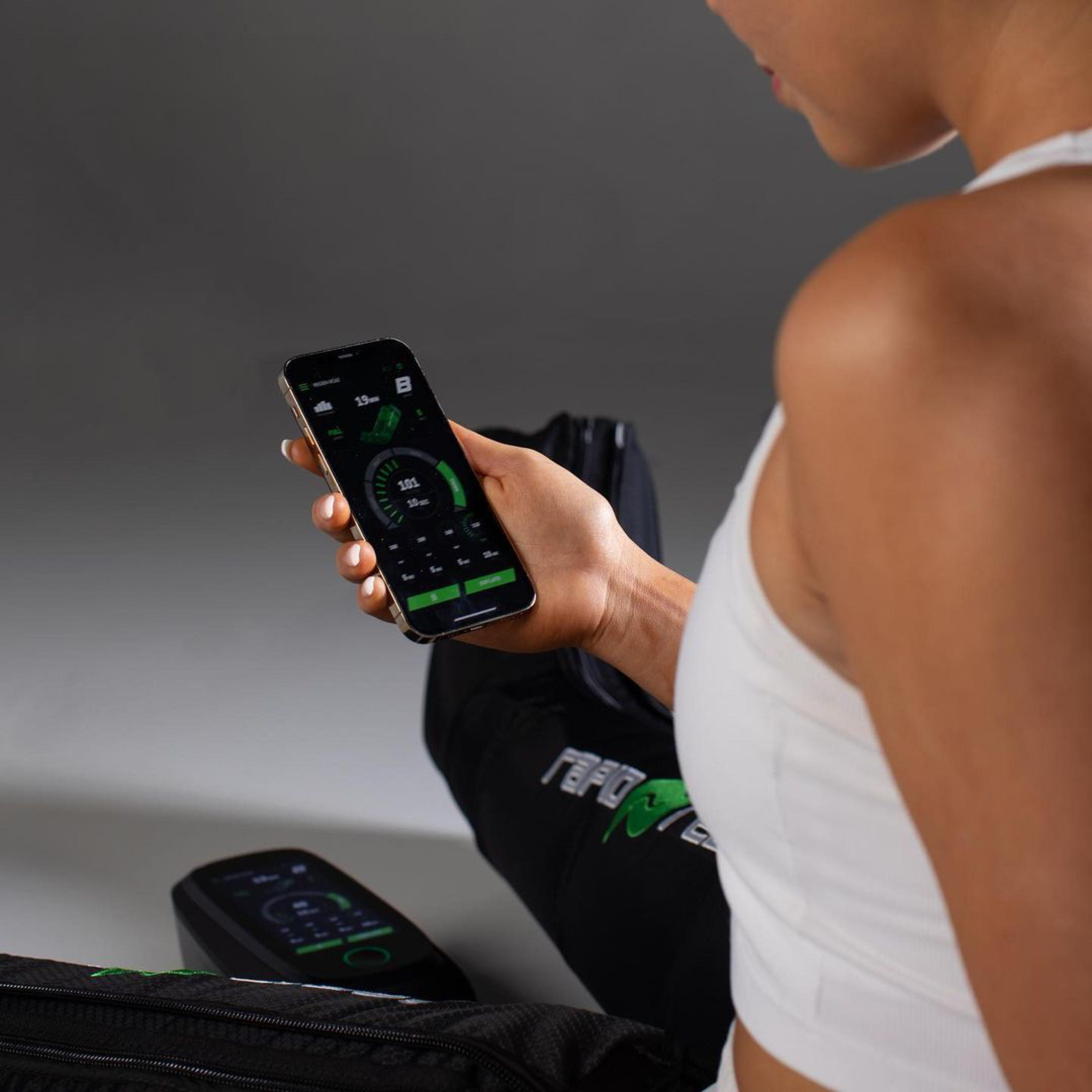 Athlete using the Rapid Reboot Pro app to adjust a REGEN recovery protocol.